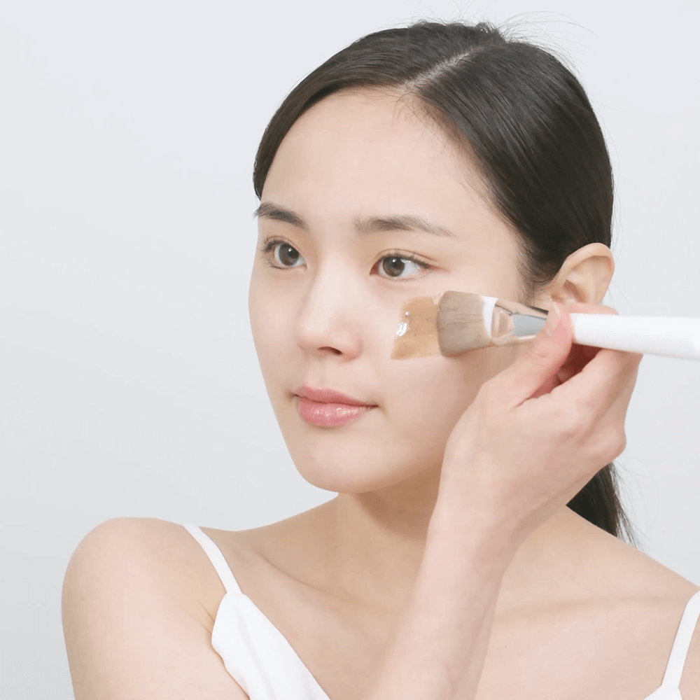 girl applying a skin care product